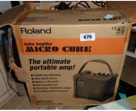 A boxed Roland microcube amplifier