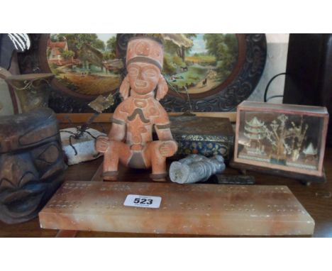 A selection of collectable items including carved Tiki mask, onyx cribbage board, etc.