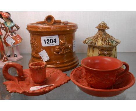 A 19th Century treacle glazed tobacco jar with applied sprig decoration - sold with a 19th Century barkware majolica lidded p