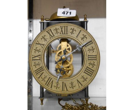 A reproduction skeleton wall clock with open dial and long pendulum, with bell striking movement - no weight