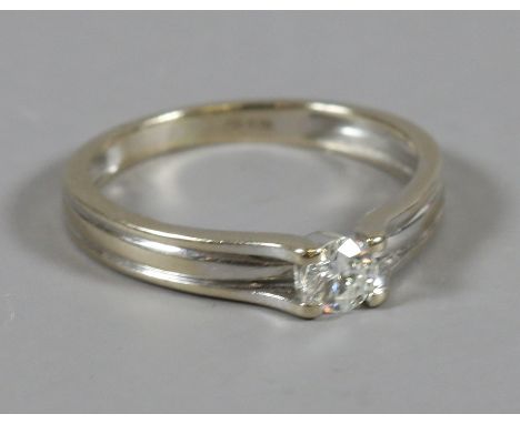 A ladies 18 carat white gold diamond solitaire ring, size L.