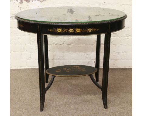 A black lacquer work two tier table with chinoiserie, hunting scene decoration in excellent condition throughout.