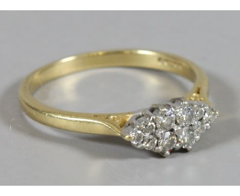 A ladies 18 carat gold diamond cluster ring, size N.