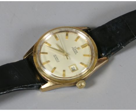 A vintage Edox Pioneer gold capped manual wristwatch with centre seconds, date window and having presentation inscription fro