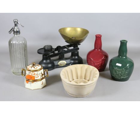 A pair of Salter brass and iron weighing scales with weights, along with a brawn mould, two Wade liqueur bottles and an Aesth