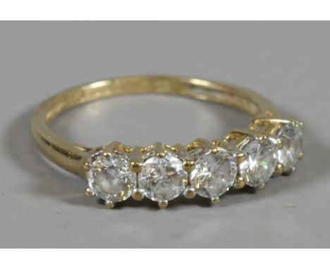 A ladies 9 carat gold five stone cubic zirconia dress ring, size N.