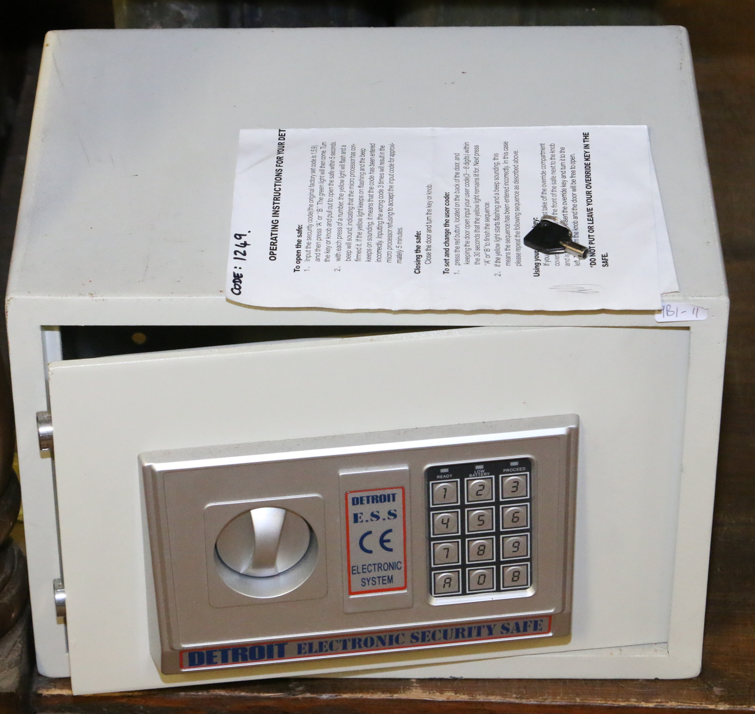 A Detroit electronic security safe with instructions and access code.