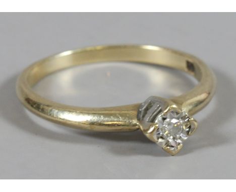 A ladies 9 carat gold diamond solitaire ring, size N.