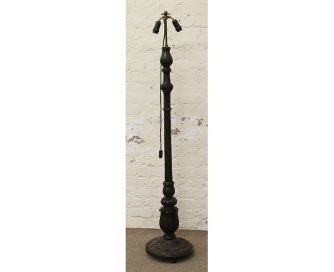 A carved hardwood twin branch standard lamp.