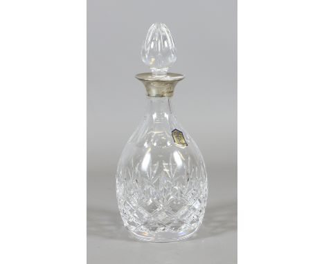 A cut glass hallmarked silver topped decanter with stopper.