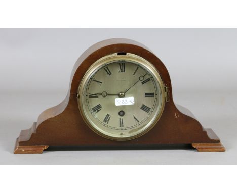 A mahogany cased mantle clock by J. Nix, Eastbourne with brass bezel, silvered dial and Roman numeral markers.