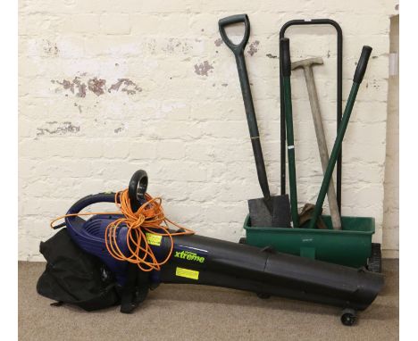 A Challenger extreme 240 volt electric garden vacuum along with a collection of assorted garden tools.