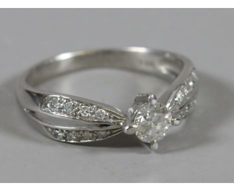 A ladies white gold diamond ring, size N.