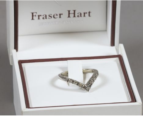 A 14 carat white gold wishbone ring set with seven diamonds, size Q.