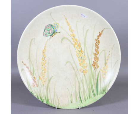 A Radford ware large pottery wall charger painted with foxgloves and a butterfly.