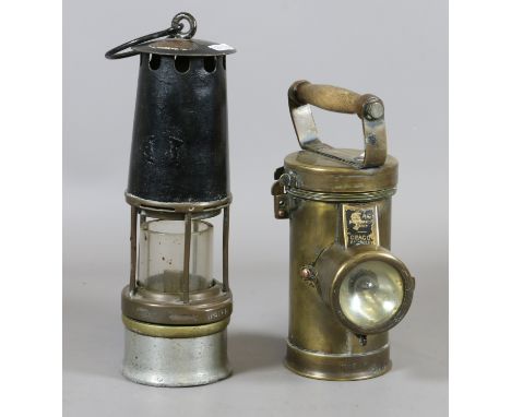 An early Eccles style miners safety lamp along with a brass cased 
C.E.A.G. inspection lamp.