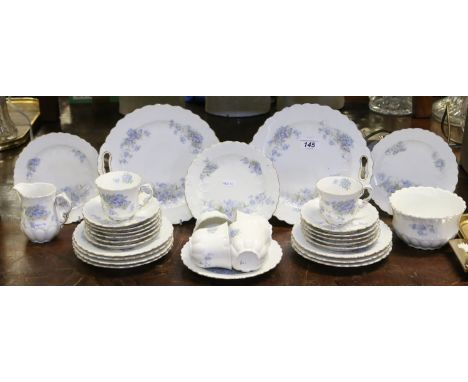 A continental antique part tea service decorated with forget me nots, approximately thirty two pieces.