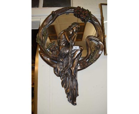 An Art Nouveau styled bronzed resin wall mirror