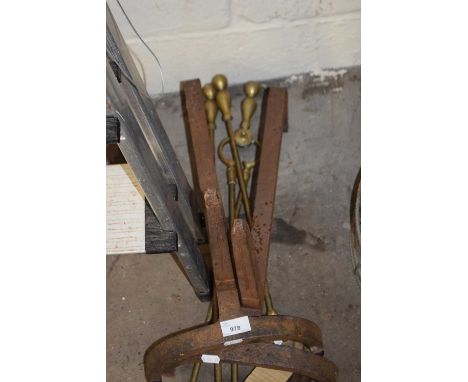 Brass fire tools and iron fire dogs