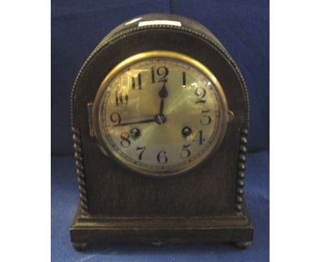 Mid 20th Century oak arch shaped, two train mantel clock.(B.P. 24% incl. VAT)