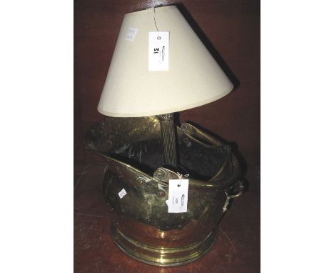 Brass helmet shaped coal scuttle, together with brass Corinthian column table lamp with shade. (2)(B.P. 24% incl. VAT)