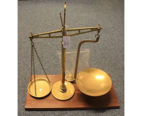 Set of brass pillar scales with trays and weights on marble platform base.(B.P. 24% incl. VAT)