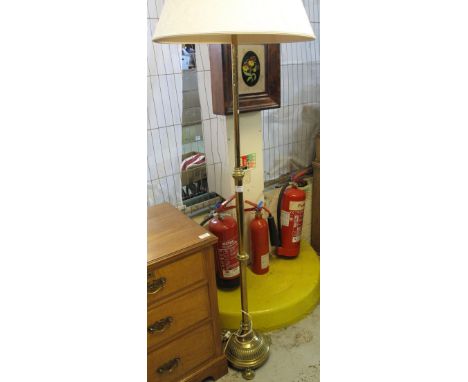 Heavy brass standard lamp with shade on circular fluted base.(B.P. 24% incl. VAT)