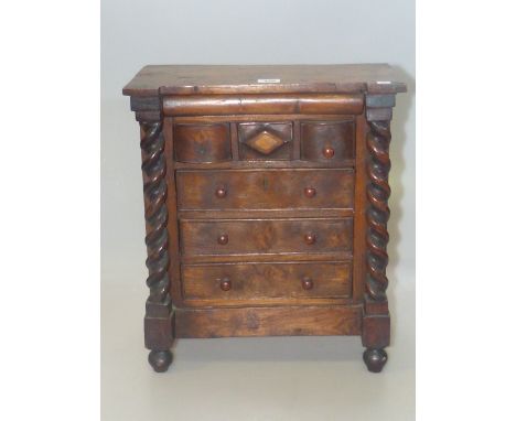 Apprentice model of a Scotch chest with three drawers and above three long drawers flanked by barley twist columns, 46cm x 39