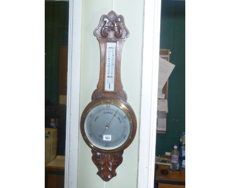 Carved oak banjo barometer having silvered dial