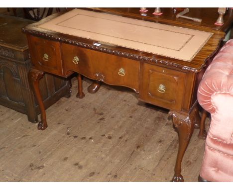 Chippendale style mahogany three drawer writing desk on carved cabriole legs to claw feet