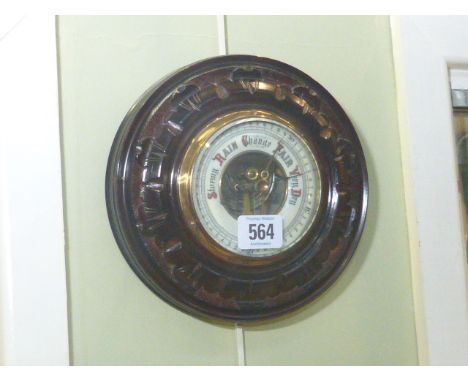 Circular carved wood framed barometer having enamelled dial