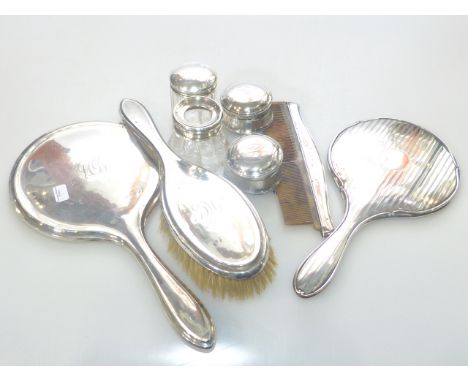 Silver backed mirrors, brush, comb and three silver topped jars and hair tidy (8)