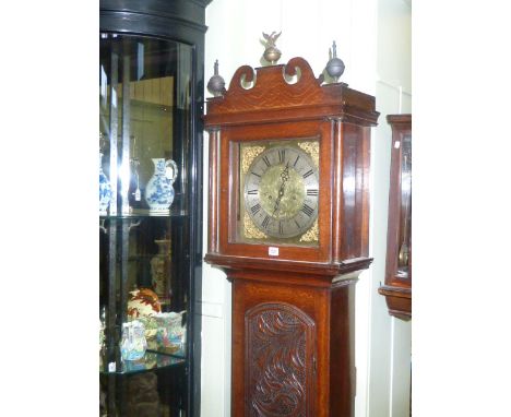 Antique carved oak eight day longcase clock having square brass and silvered dial, signed James Mills, Long Milford