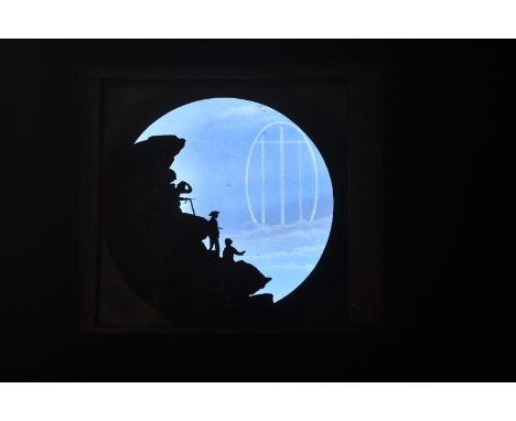 A Mahogany-Mounted Newton ‘Spectre of Brocken’ Mountain Scene Hand-Coloured Magic Lantern Slide Dissolve Set, climbers on mou