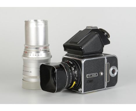 A Hasselblad 500C Camera, chrome, serial no. TT64527, with prism finder, with Carl Zeiss Planar T* f/2.8 80mm lens, black, se