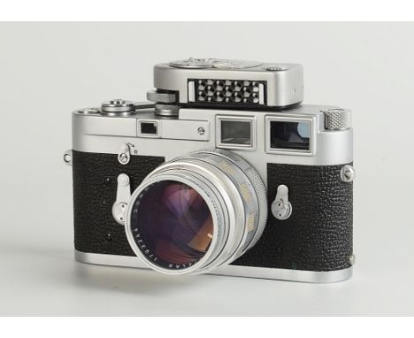 A Leica M3 Rangefinder Camera, chrome, serial no. 1003798, with Leitz Summilux f/1.4 50mm lens, chrome, serial no. 1703344, b