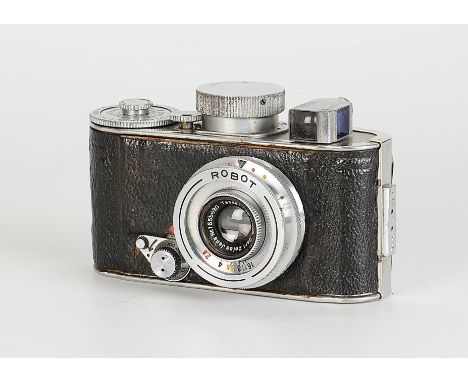 A Berning Robot I Camera, chrome, serial no. 4181, with Carl Zeiss Jena Tessar f/2.8 30mm lens, chrome, serial no. 1655680, b