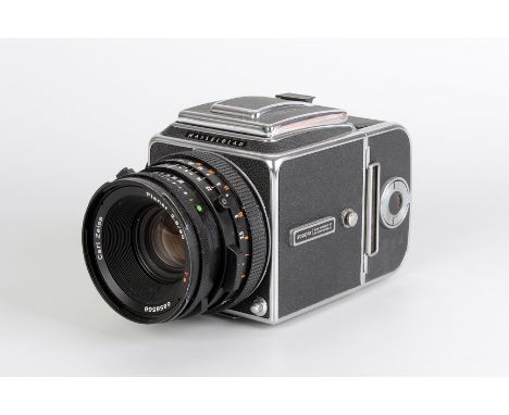 A Hasselblad 500CM Camera, chrome, serial no. RT1309079, with Carl Zeiss Planar CF T* f/2.8 80mm lens, black, serial no. 6858