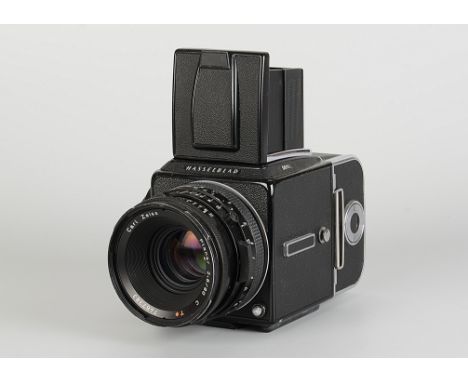 A Hasselblad 501C Camera, black with chrome back, serial no. 17EI10476, with Carl Zeiss Planar C T* lens, black, serial no. 7