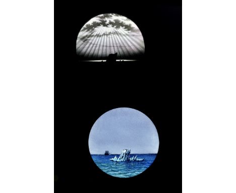 A Carpenter & Westley ‘Aurora Australis’ hand-painted mahogany-mounted Magic Lantern Dissolve Set, circular, static, iceberg 