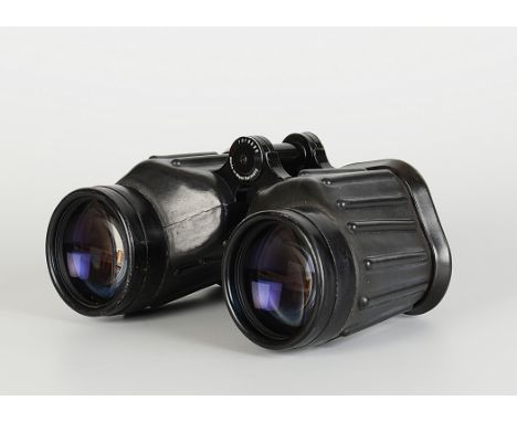 A pair of Carl Zeiss 7x50B Binoculars, black rubberised, serial no. 1015699, body, VG, slight tear to rubber cap mount, optic