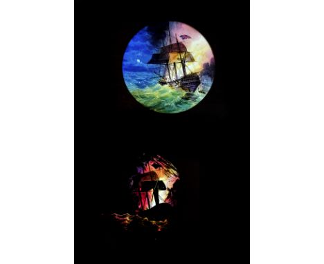 A Blazing Warship hand-painted mahogany-mounted Magic Lantern Dissolve Set, circular, static, blazing Royal Navy three-mast w