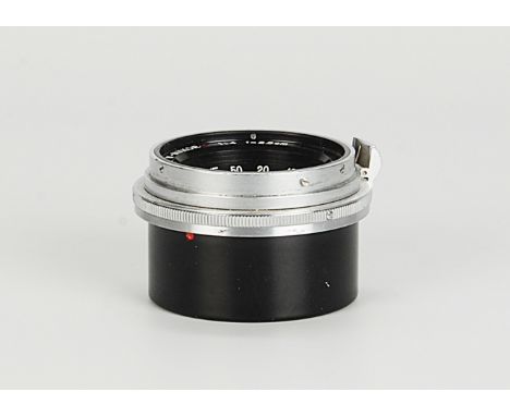 A Nikon W-Nikkor.C f/4 25mm Lens, chrome, serial no. 403280, body, G-VG, elements, G, some cleaning marks and light internal 
