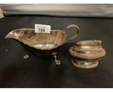 A SILVER PLATED JUG AND A CIGARETTE LIGHTER 