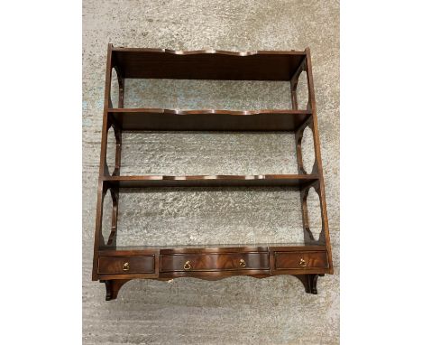 A MAHOGANY FOUR SHELF HANGING PIECE WITH BRASS HANDLE FITTINGS 