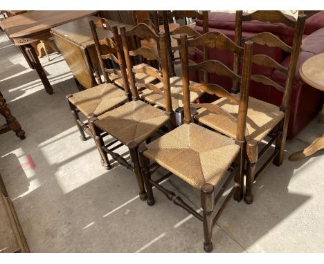 A SET OF SEVEN LANCASHIRE STYLE LADDER BACK RUSH SEATED DINING CHAIRS 