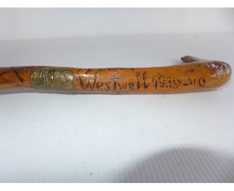 A CARVED STICK WITH INSCRIPTION WESTWALL 1939-40, THE WESTWALL ALSO KNOWN AS THE SIEGFRIEU LINE 