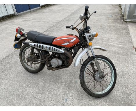 A 1977 SUZUKI TS 185 TRAIL MOTORCYCLE, BELIEVED GENUINE 12390 MILES, REGISTERED WITH DVLA BUT V5 NOT INCLUDED, ENGINE KICKS O