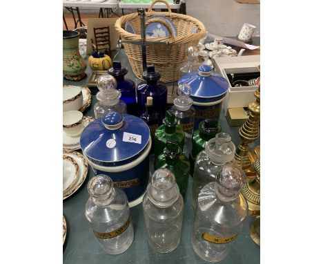 A SELECTION OF GLASS AND CERAMIC CHEMIST JARS WITH NAMES TO INCLUDE A SET OF BOXED CHEMIST SCALES 