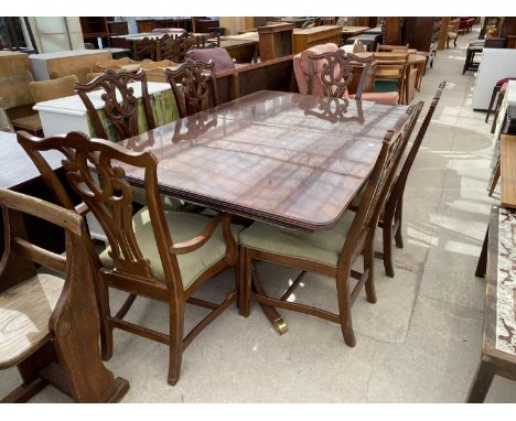 A GEORGIAN STYLE TWIN PEDESTAL DINING TABLE (68" x 44") AND SIX CHIPPENDALE STYLE DINING CHAIRS BY UNIVERSAL 